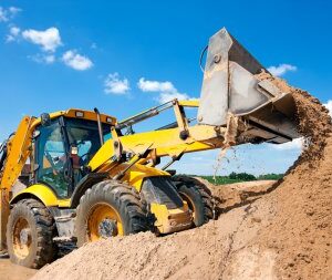 depositphotos 26524151 stock photo excavator machine unloading sand with